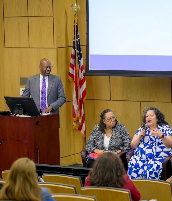 Louis Hill Jr. moderating panel at SMU